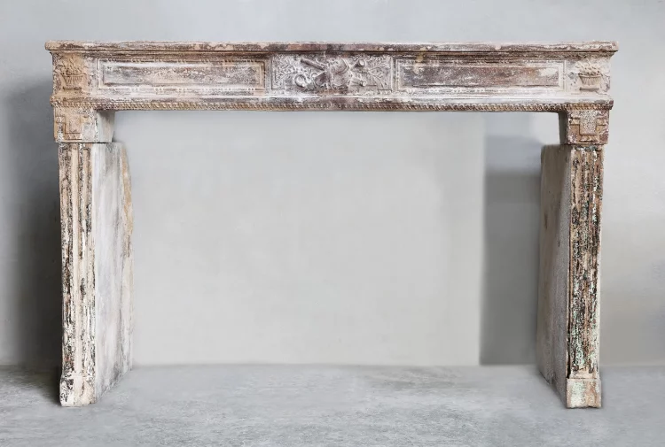 Antique fireplace of limestone