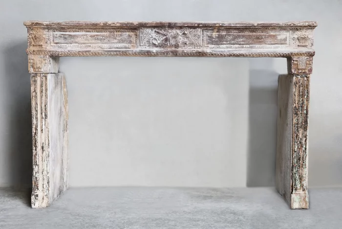 Antique fireplace of limestone