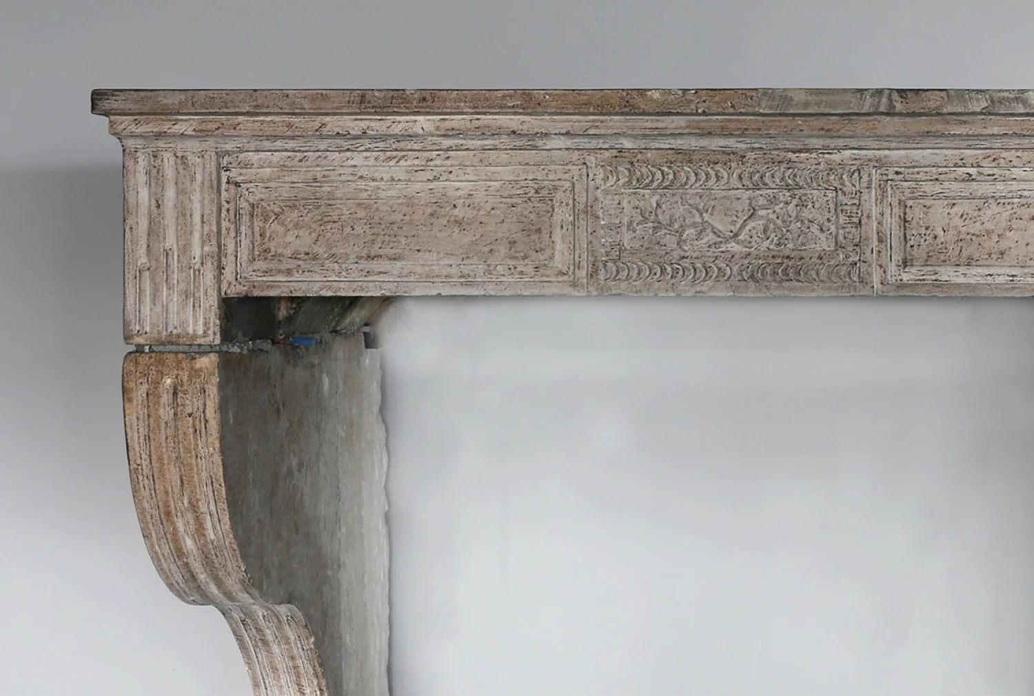 Antique fireplace of limestone