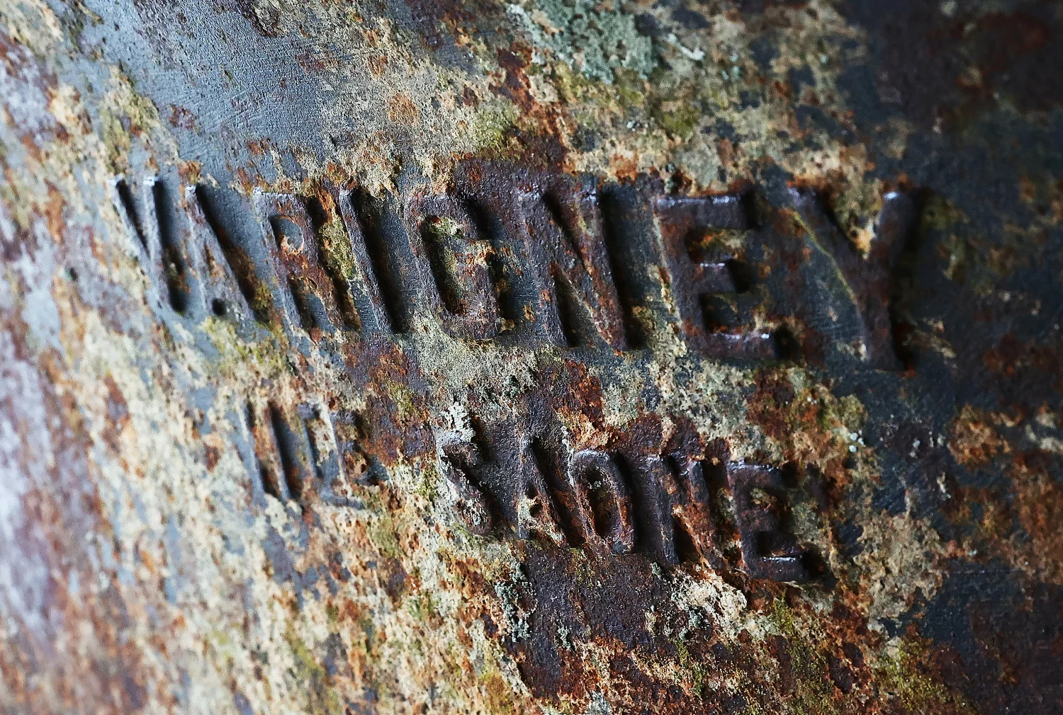 Foundry mark detail on antique cast-iron trough, circa 1880-1920, showing Fonderie de Varigney – Haot Saone