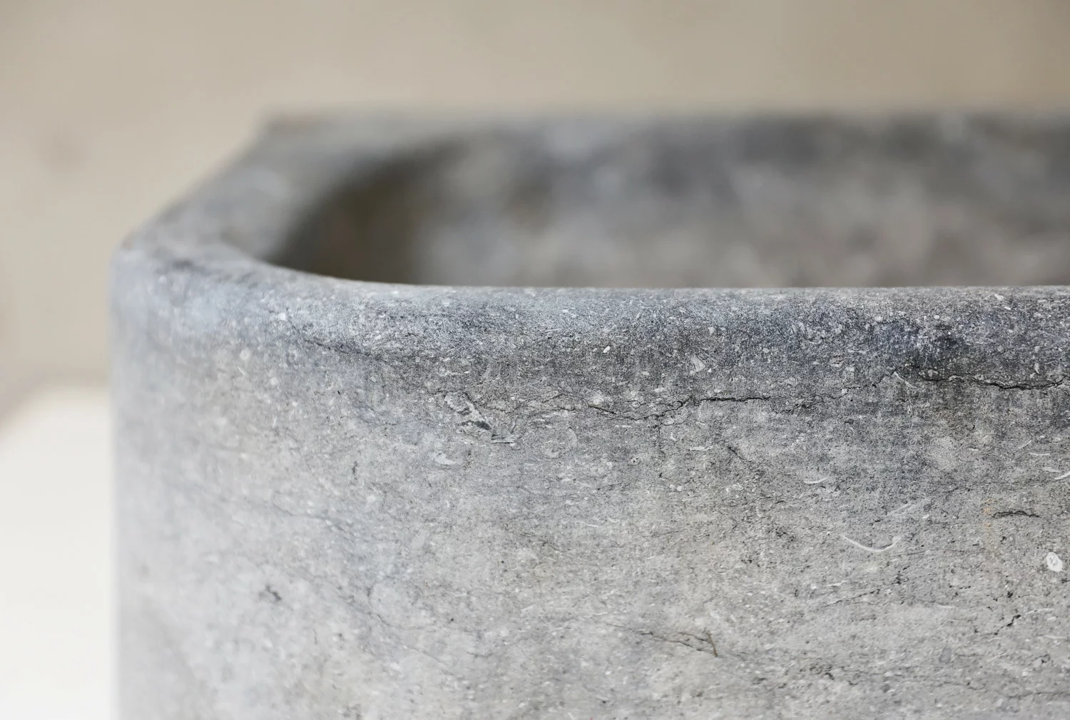 rSculptural antique limestone basin in Belgian bluestone, uniquely rounded shape, hand-carved and reclaimed