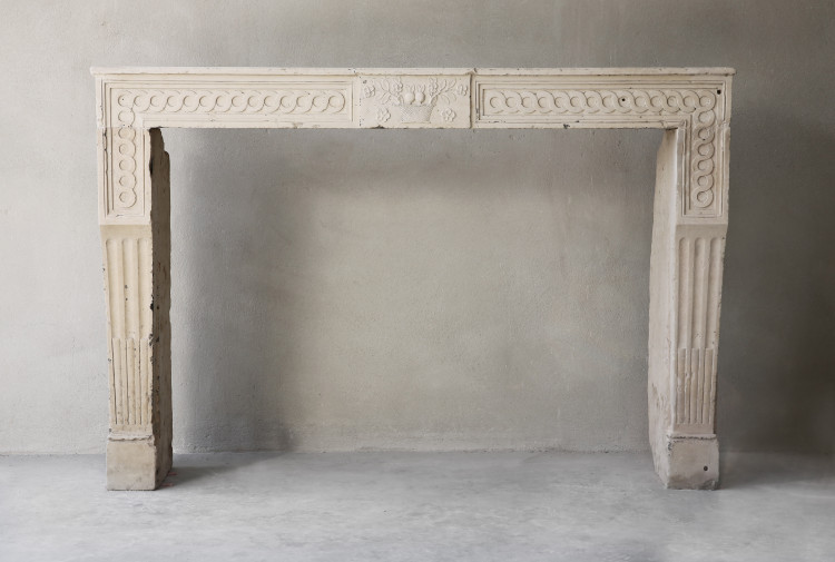Antique french limestone fireplace