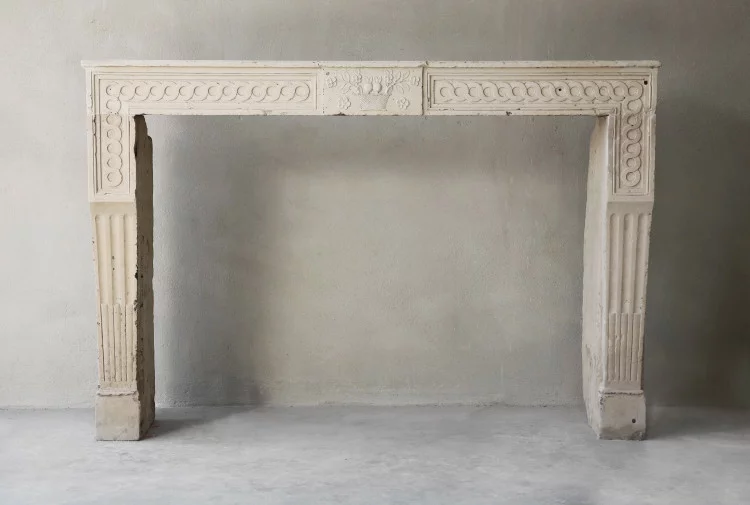 Antique french limestone fireplace