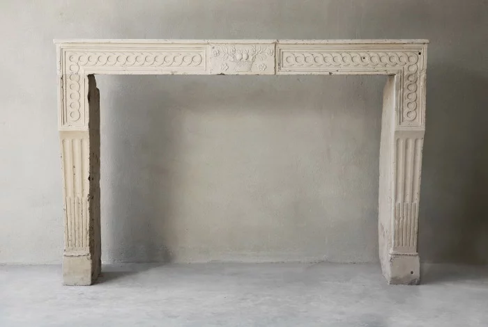 Antique french limestone fireplace