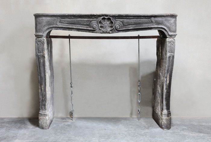 Antique fireplace of lava stone