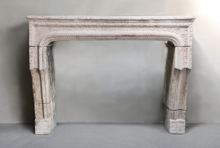 Antique fireplace of limestone