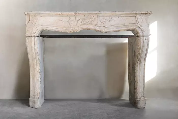 Antique fireplace of limestone