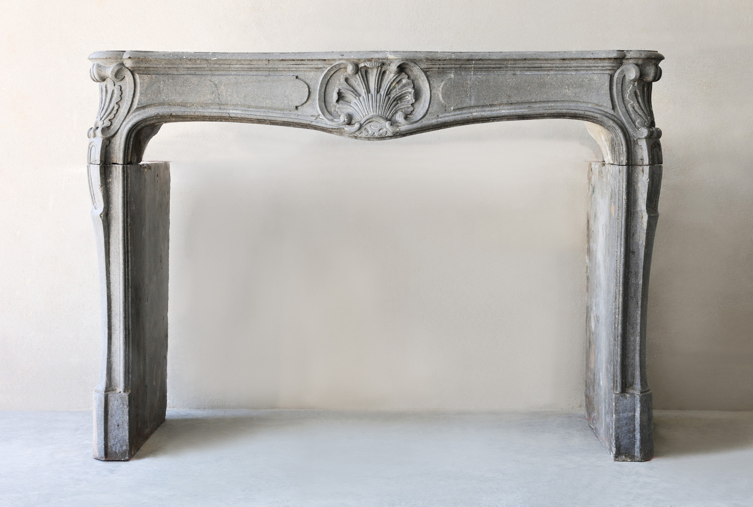 antique fireplace of marble stone