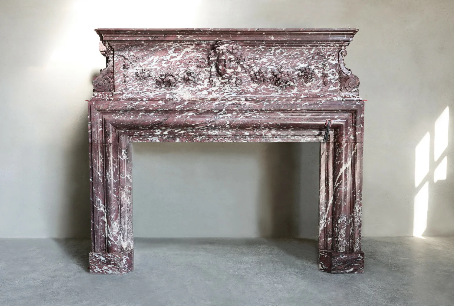 Monumental antique Fleur de Pêcher marble mantelpiece in Louis XIII style, full front view