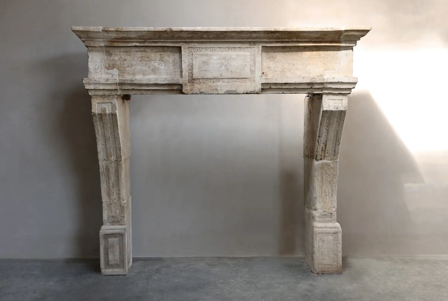 antique fireplace of French limestone