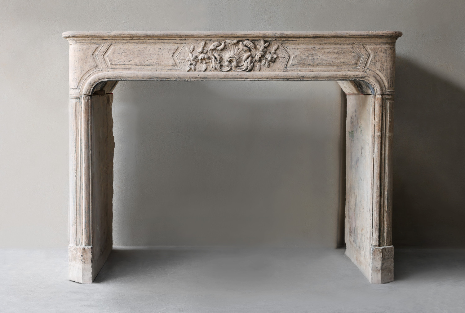 antique fireplace of french limestone