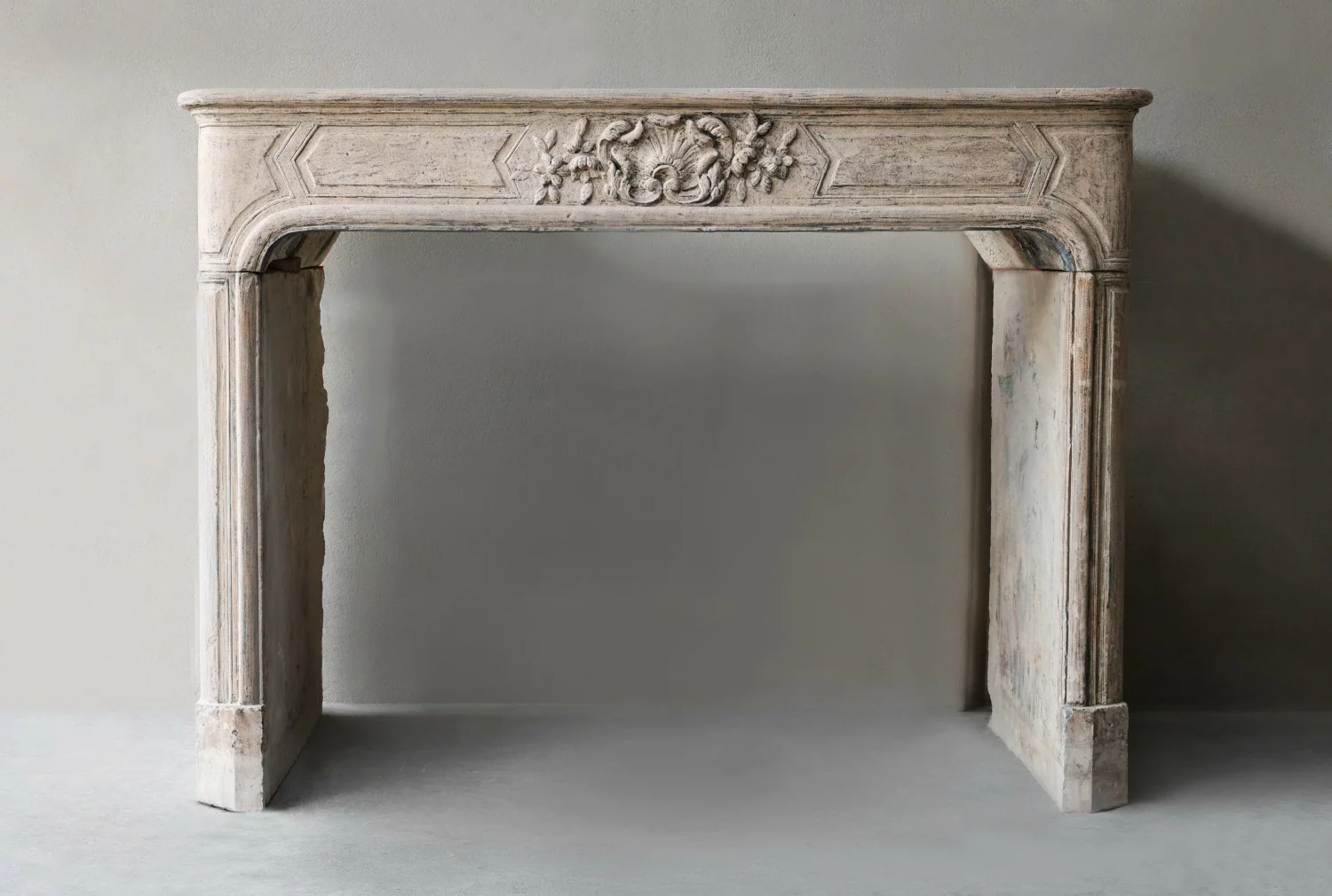 antique fireplace of french limestone