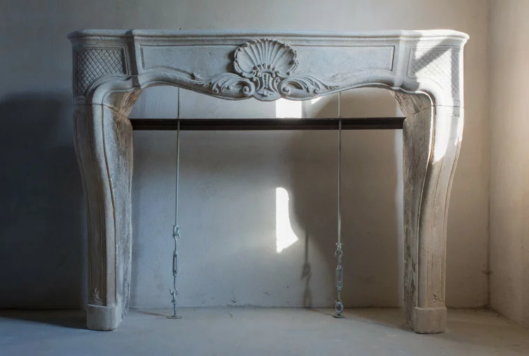 Antique limestone fireplace