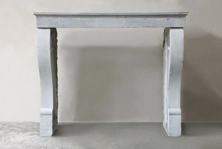 Antique fireplace of marble stone