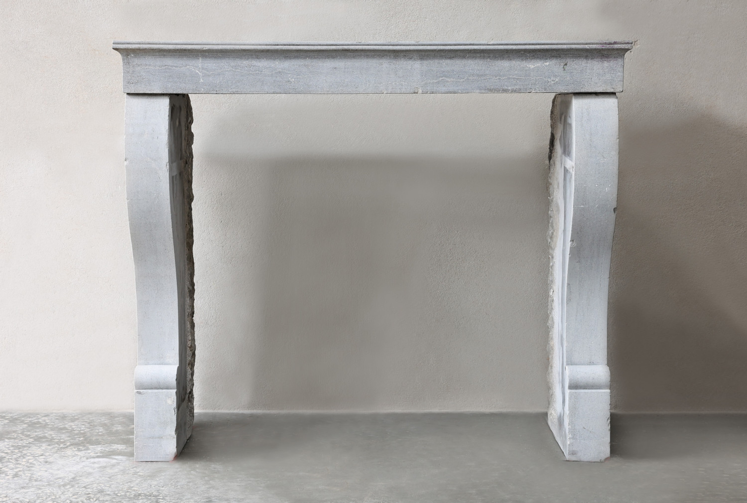 antique fireplace of marble stone