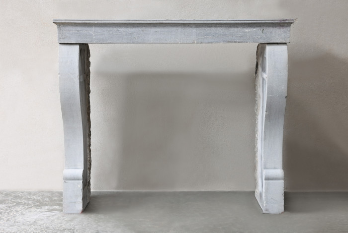 Antique fireplace of marble stone