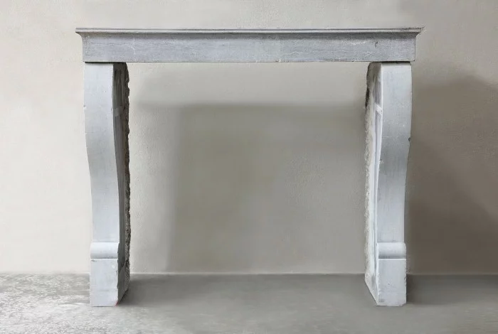 Antique fireplace of marble stone