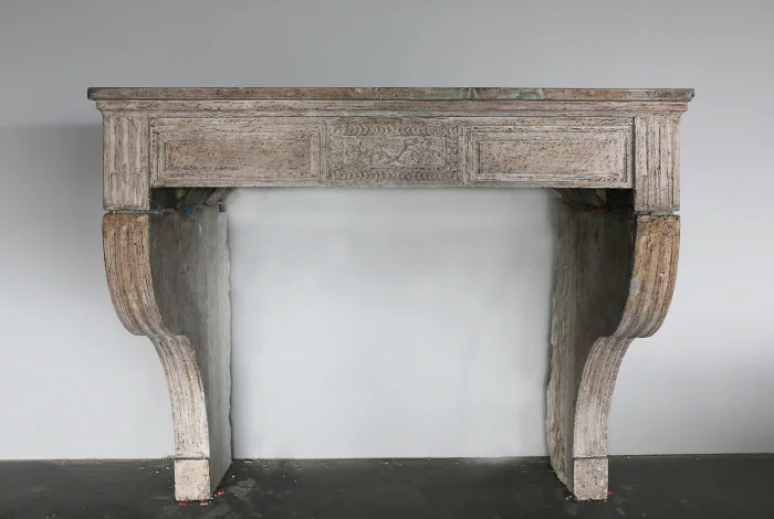 Antique fireplace of limestone