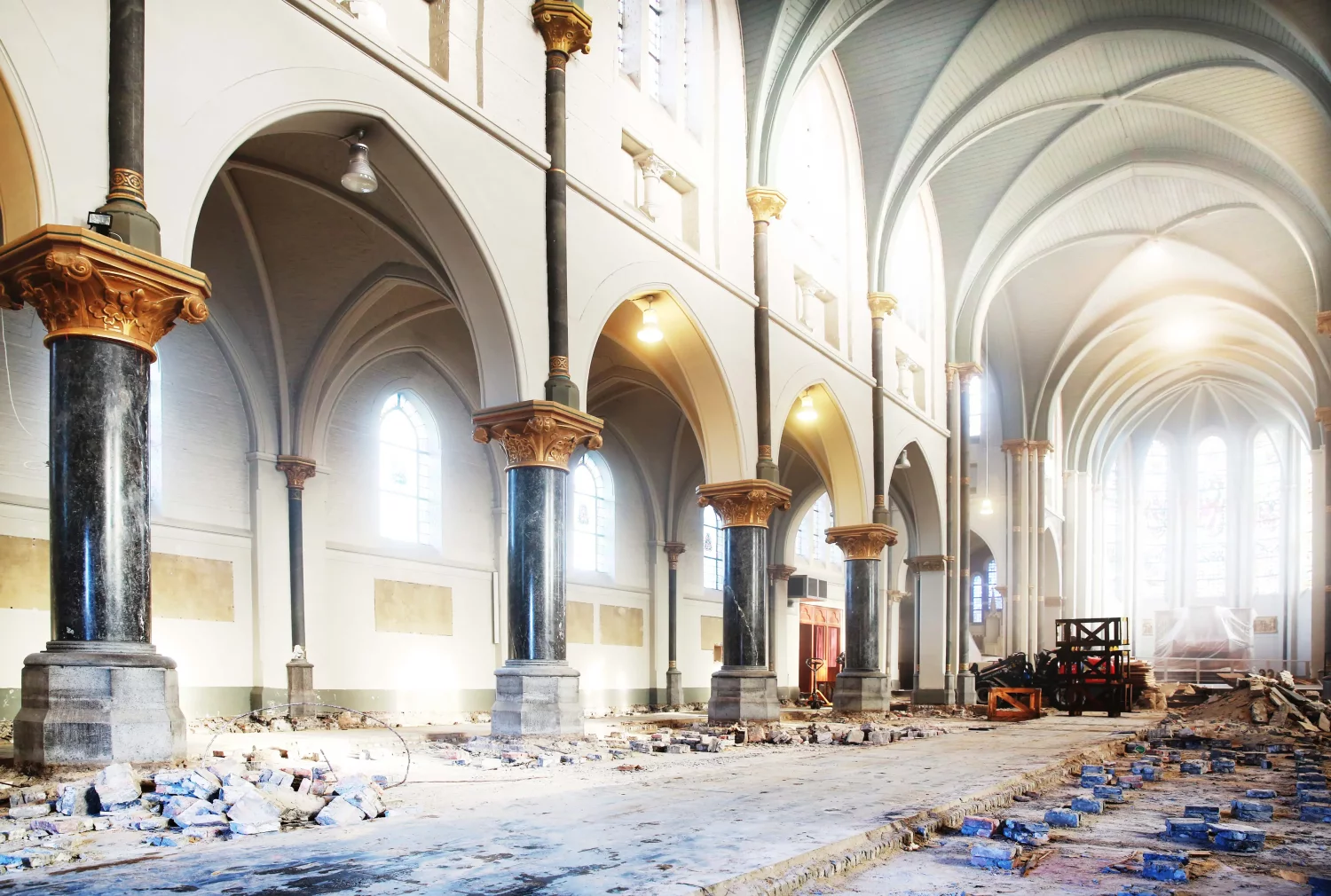 De Opkamer team reclaiming a Belgian black limestone floor from an 18th-century church in Klundert, the Netherlands