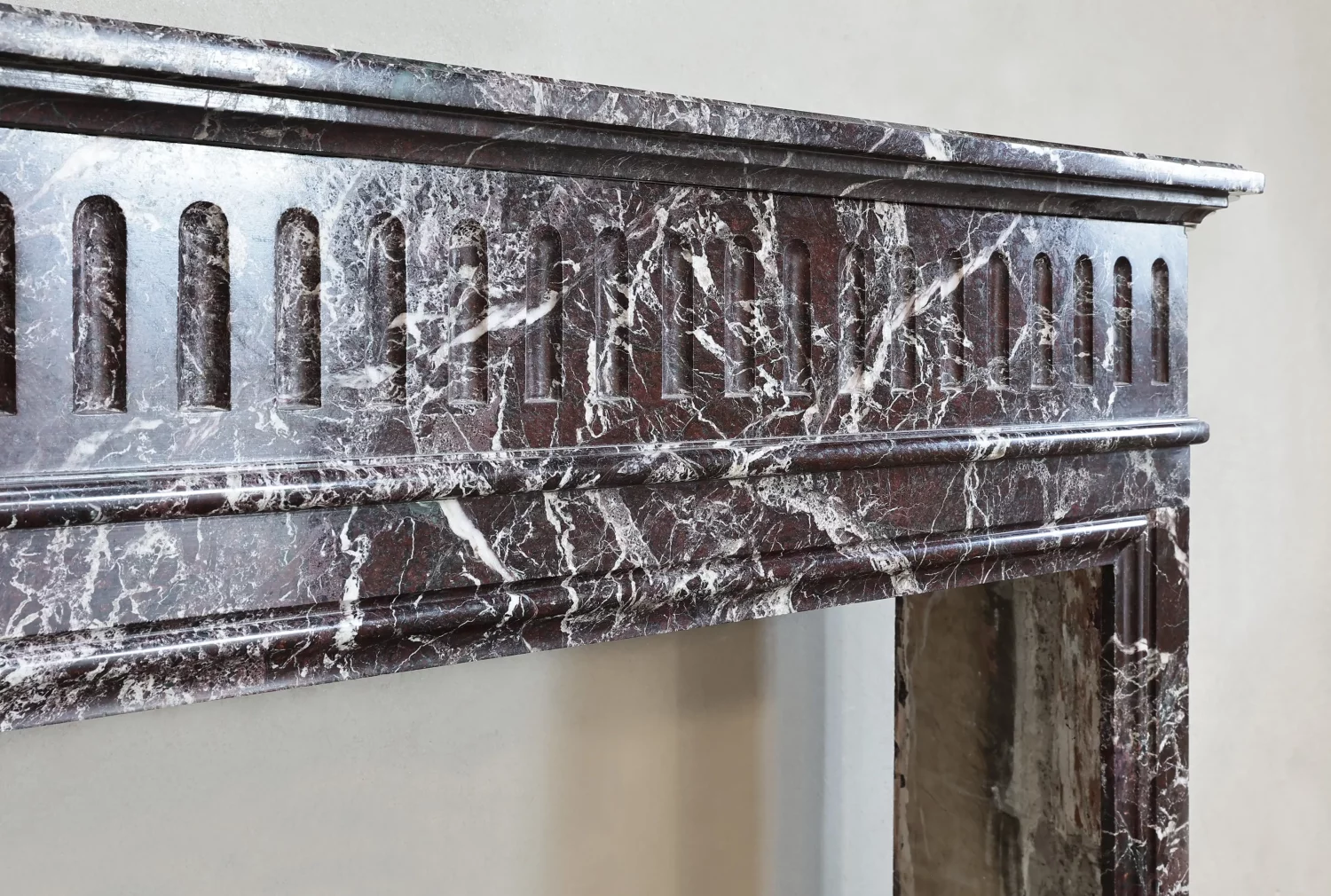 Close-up of frieze and veining on antique fireplace surround in Rouge Levanto marble, Ref. 1172