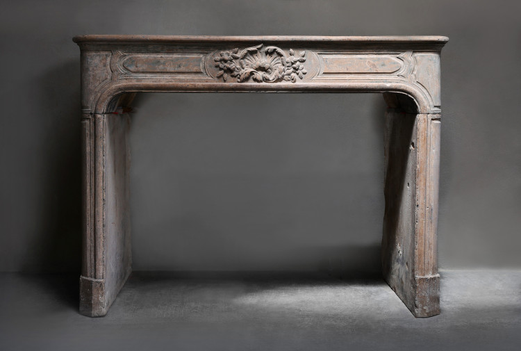 Antique fireplace of limestone