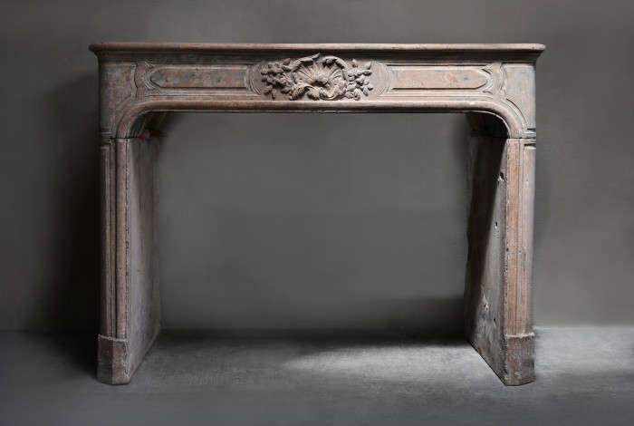 Antique fireplace of limestone