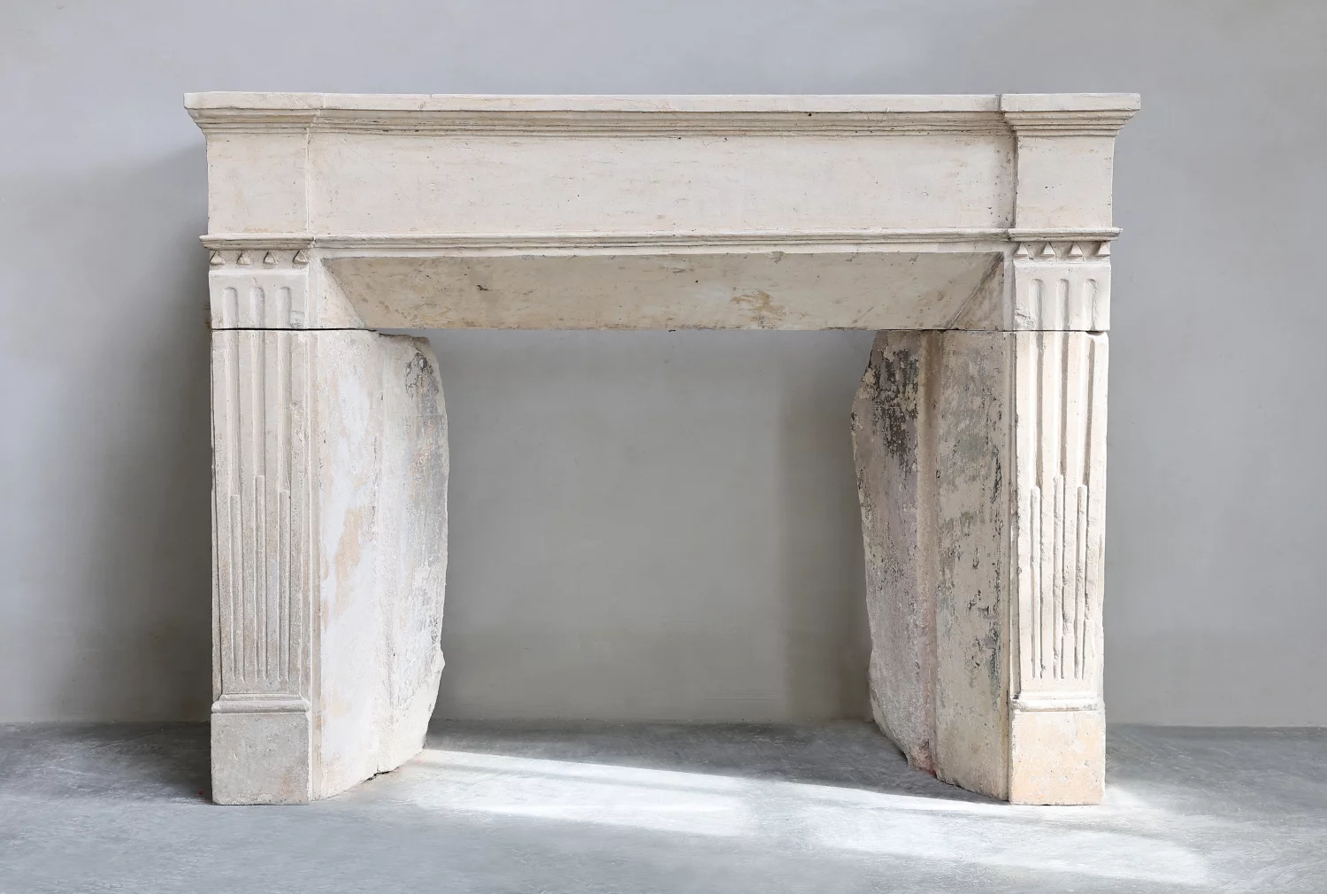 antique fireplace of limestone