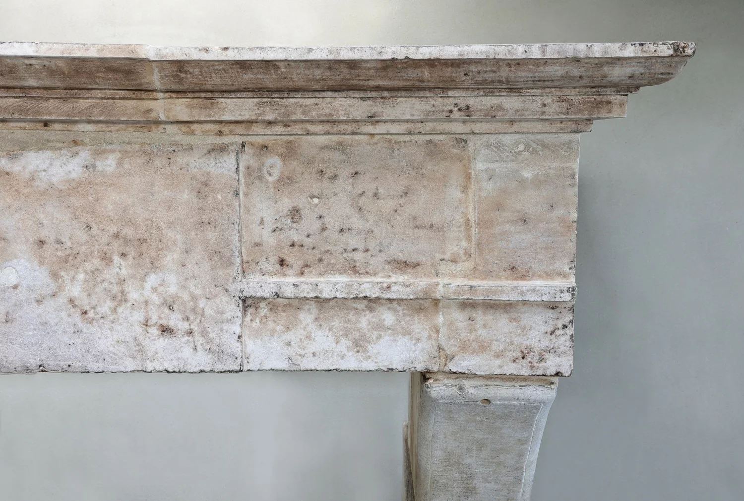 old mantle surround of french limestone
