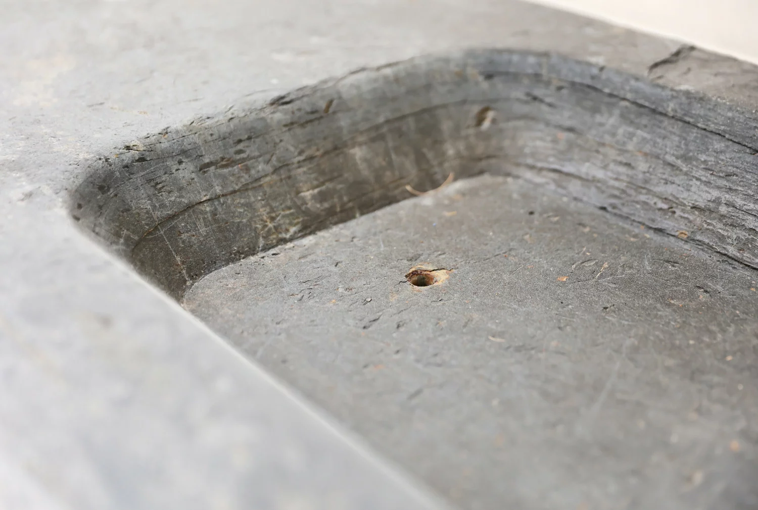 old wash basin of belgian bluestone
