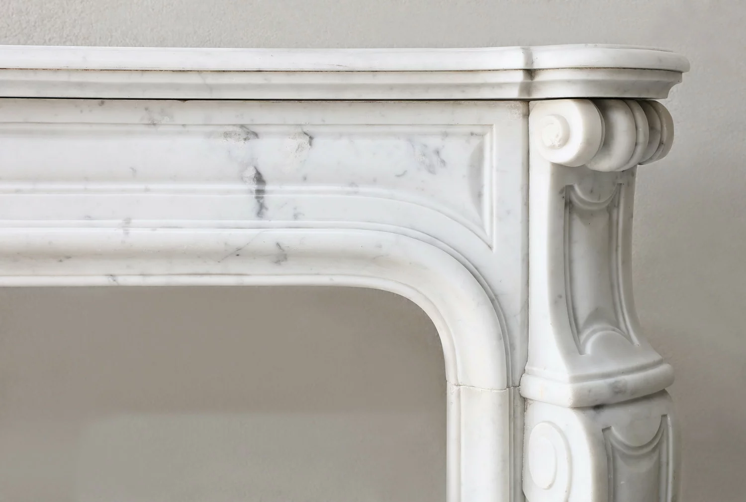 Detail of right corner carving on antique Carrara marble fireplace mantel, Pompadour style, circa 1840-1860