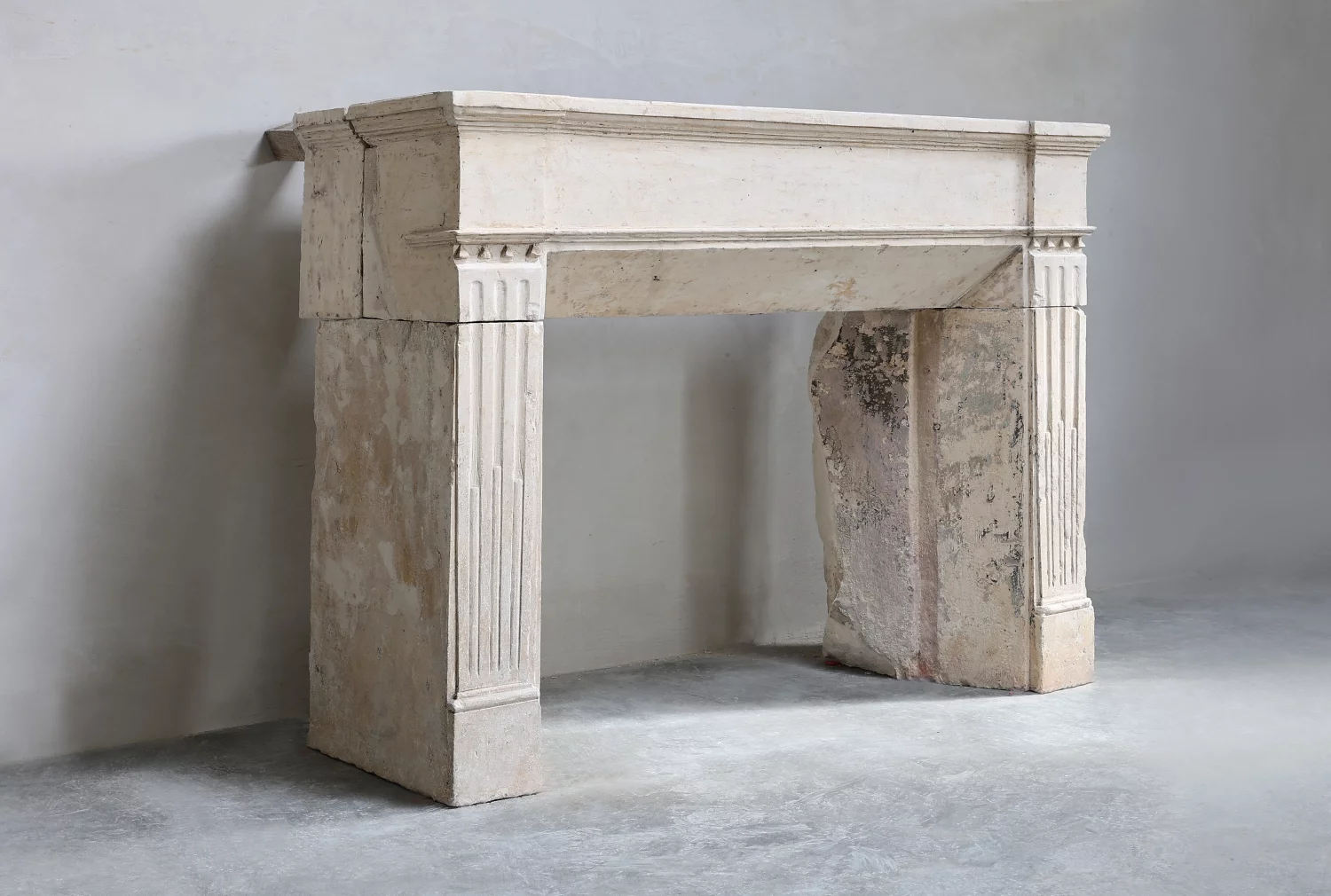antique mantel of French limestone