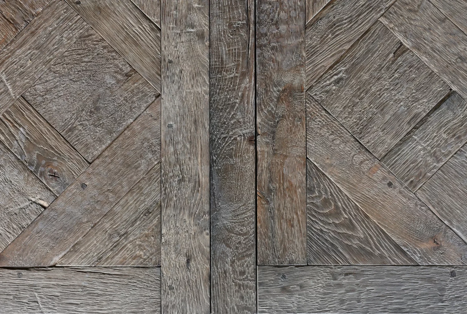 Subtly aged Le Marais Versailles parquet panel with warm oak finish