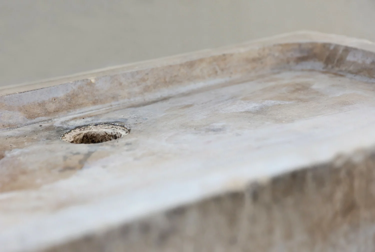 reclaimed sink of burgundy stone