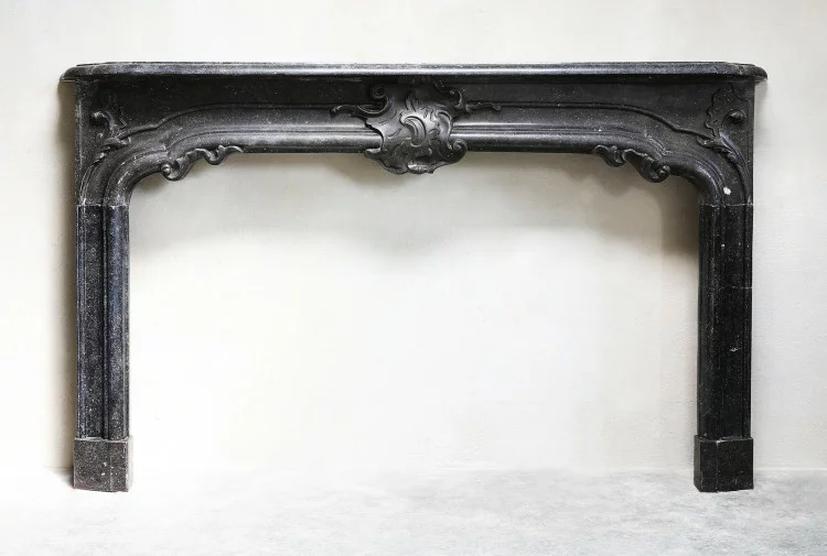 Antique mantle of belgian stone